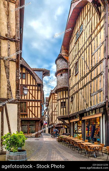 Street with historical half-timbered houses in Troyes, France