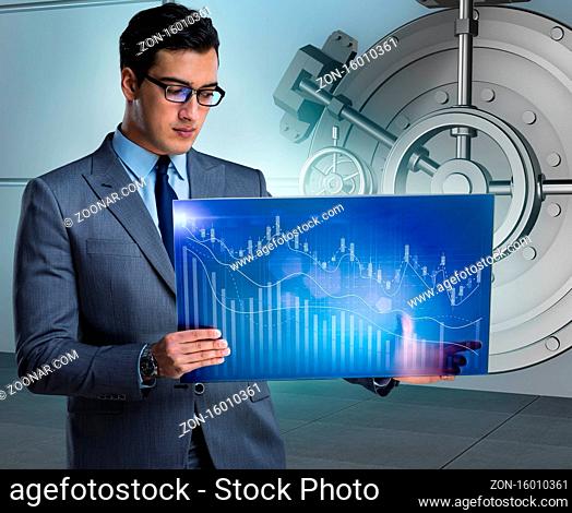 The businessman with touchscreen in financial banking concept