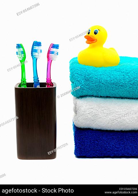 Toothbrushes in toothbrush holder isolated against a white background