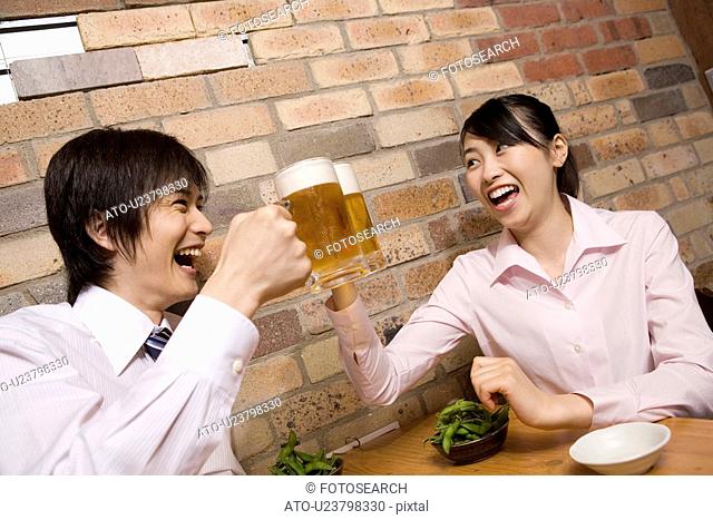 Office workers enjoy drinking a beer