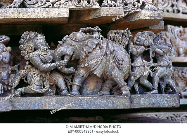 Mahabharata Bhima killing elephant in Hoysaleswara temple at Halebid , Karnataka , India