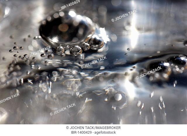 Bubbles in a liquid, carbon dioxide in mineral water