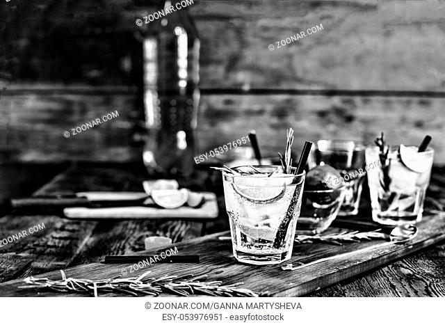 black and white. alcohol. two glass of fresh mojito cocktail on wooden table with copy space
