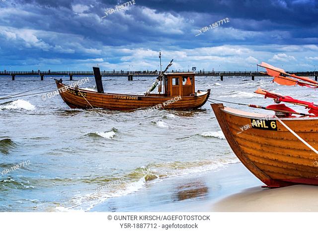 Two Fishing boats at the beach of the Baltic Sea, near the pier of the Baltic Sea resort of Ahlbeck, Municipality of Heringsdorf, Usedom Island