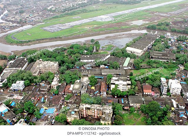 An aerial view of area surroundings runways also Mithi river flowing through airport area at Mumbai's Chhatrapati Shivaji Maharaj International airport at Sahar...
