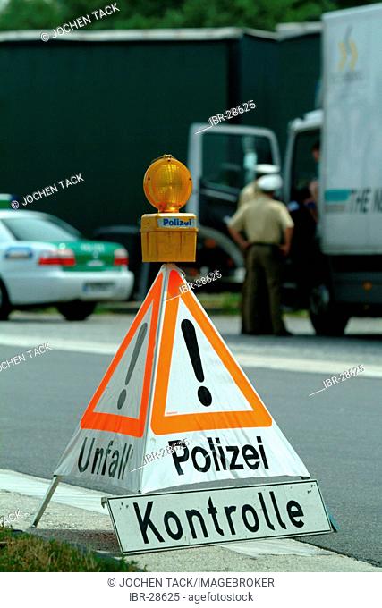 DEU, Germany, NRW: Controll of trucks at the highway A4 near Cologne. The police officers check the security of the cargo, the saftey of the trucks and drivers