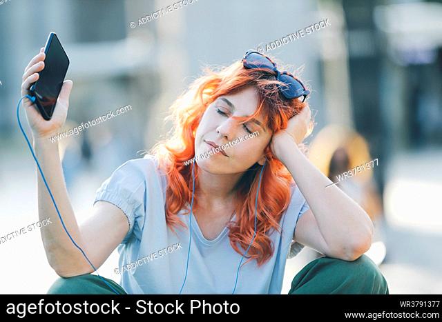 young woman, enjoy, urban, listening music