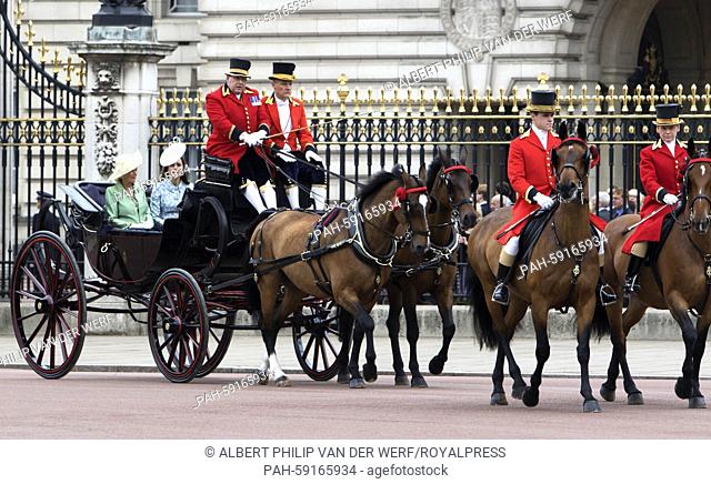 Britain's Catherine, Duchess of Cambridge (2nd L) and Camilla (L), Duchess of Cornwall return to Buckingham Palace following the Trooping of the Colour Queen's...