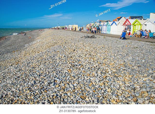 colourful wooden cabins and pebbles beach at Cayeux sur Mer in Normandy, France