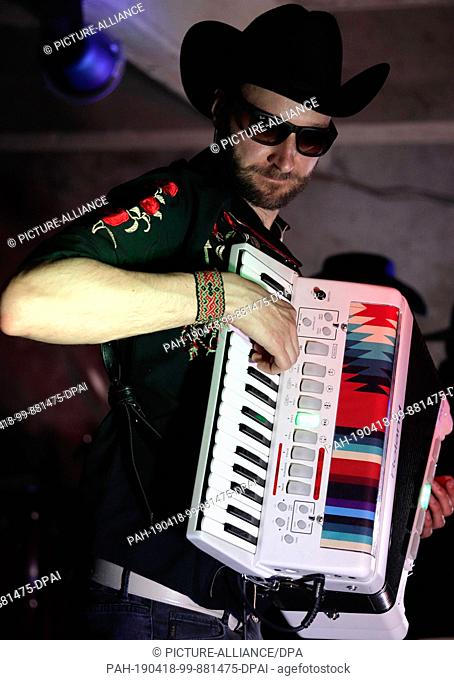 17 April 2019, Mexico, Mexiko-Stadt: Max Guru plays accordion during his performance with the Franconian band ""Los Pistoleros Güeros"" in the Pulquería Las...