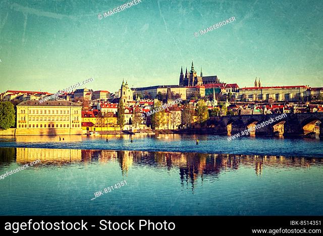Vintage retro hipster style travel image of Mala Strana and Prague castle over Vltava river with grunge texture overlaid