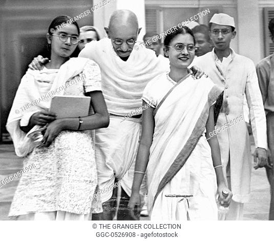 MOHANDAS GANDHI (1869-1948). /nHindu nationalist and spiritual leader. Photographed with his granddaughters in New Delhi, India, 1947