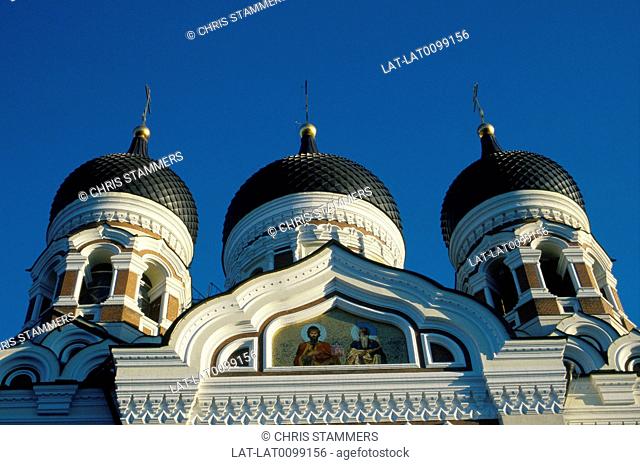Alexander Nevsky cathedral. White stone building. Three domes