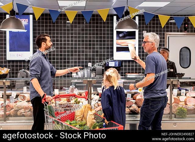Customers talking in supermarket