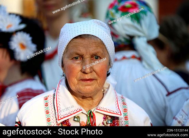 Belarus, Gomel, May 20, 2017.Belarus, Gomel, May 20, 2017. Holiday in the branch of the Vetkovsky Museum.Old woman in scarf and national clothes