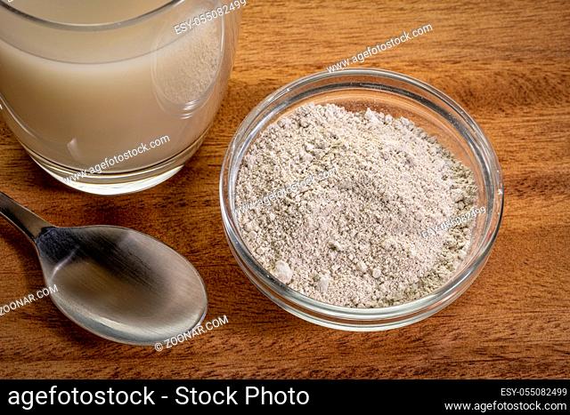 food grade diatomaceous earth supplement - powder and in a glass of water