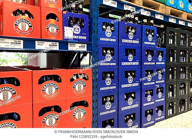 stacked full beer crates in a drinks market.Erdinger Weissbier, Schneider Weise, | usage worldwide. - Munich/Bayern/Deutschland