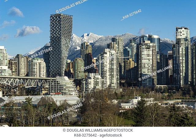 Skyline, dominated by Vancouver House, designed by Bjarke Ingels Group, from the south side of False Creek, Vancouver, BC, Canada