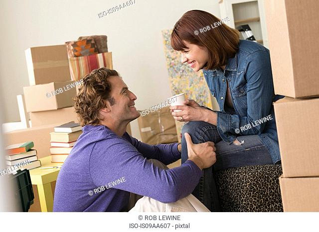 Couple taking a break whilst moving