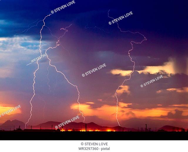 Three bolts of lightning striking near the Palo Verde Nuclear Station in Wintersburg Arizona during the 2012 Monsoon season, Arizona, United States of America