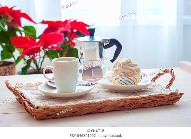 Breakfast with marshmallow or zephyr with a cup of coffee near Christmas poinsettia