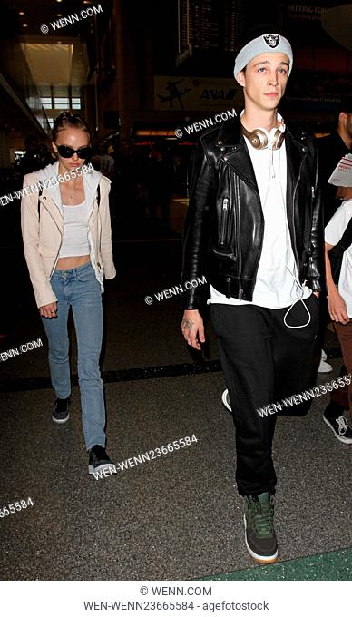 Lily Rose Depp, boyfriend Ash Stymest, brother John Depp, and mother Vanessa Paradis arrive at Los Angeles International Airport Featuring: Lily Rose Depp