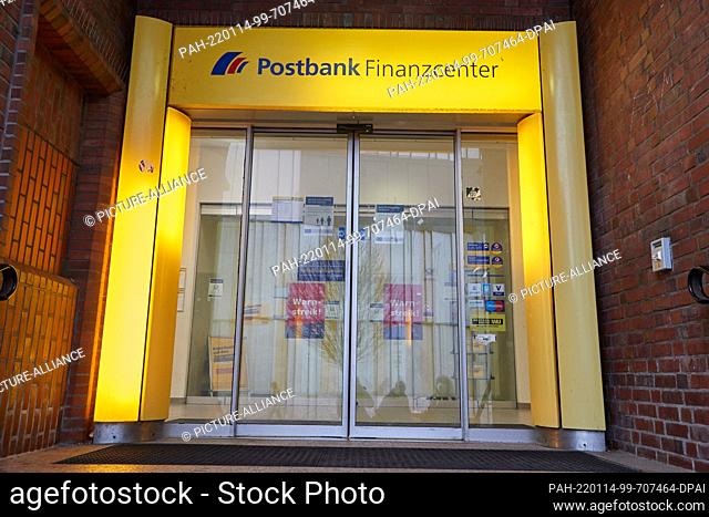 14 January 2022, Hamburg: Signs reading ""warning strike"" are stuck to the closed glass doors at a Postbank branch in Hamburg-Altona