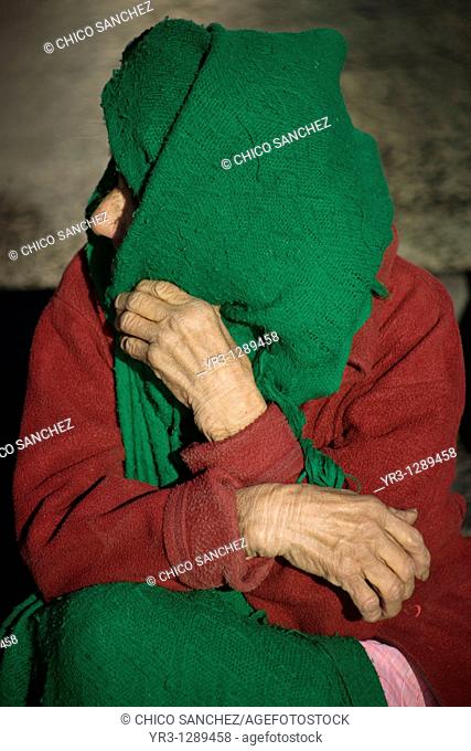 An elderly pilgrim sits at the entrance of the Our Lady of Guadalupe Basilica in Mexico City. Hundreds of thousands of Mexican pilgrims converged on the...