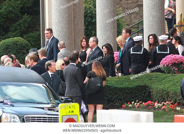 Friends and family attend the funeral of baseball legend Yogi Berra, held at the Church of the Immaculate Conception. Berra died at age 90