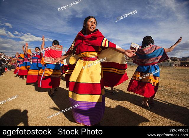 Indigenous people with traditional costumes during a performance at the Inti Raymi Festival 2018 in Saqsaywaman Archaeological Site, Cusco, Peru, South America