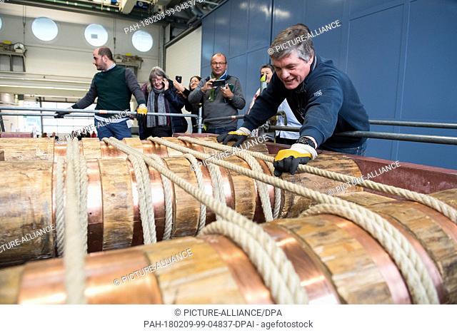 Uwe Dorka (6-L), line manager of steel and composite construction at the University of Kassel, checks the ropes of a true to the original 1-1 replica of a...