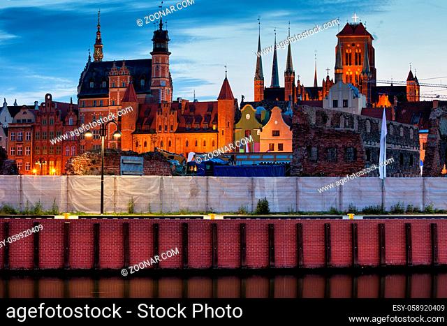 City of Gdansk Old Town skyline at dusk in Poland, embankment of Motlawa River