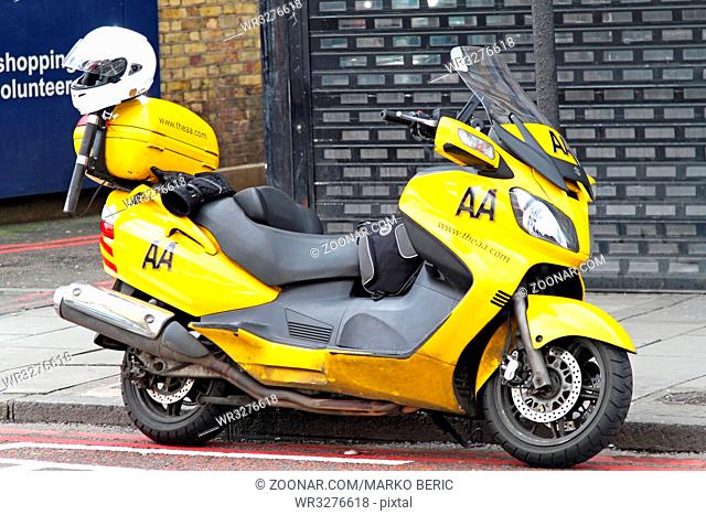 LONDON, UNITED KINGDOM - APRIL 04: AA scooter in London on APRIL 04, 2010. Yellow AA scooter for road assistance in London, United Kingdom