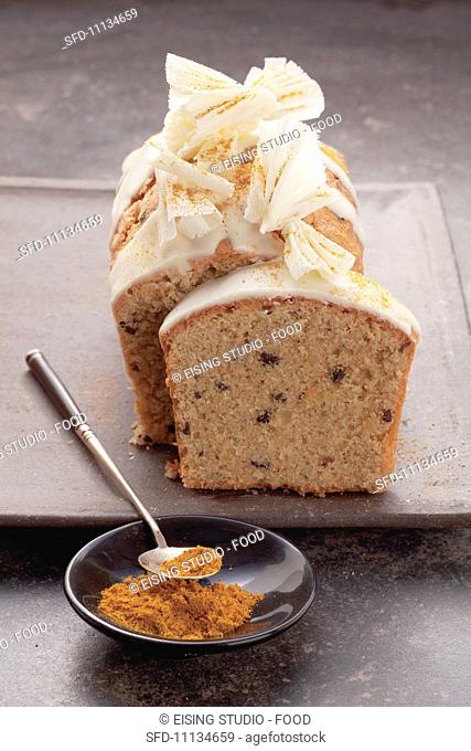 Spice cake topped with white chocolate and curry powder