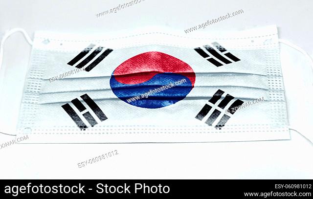 surgical mask with the national flag of South Korea printed. Pandemic covid-19 and preventive measures to counter the spread of the virus