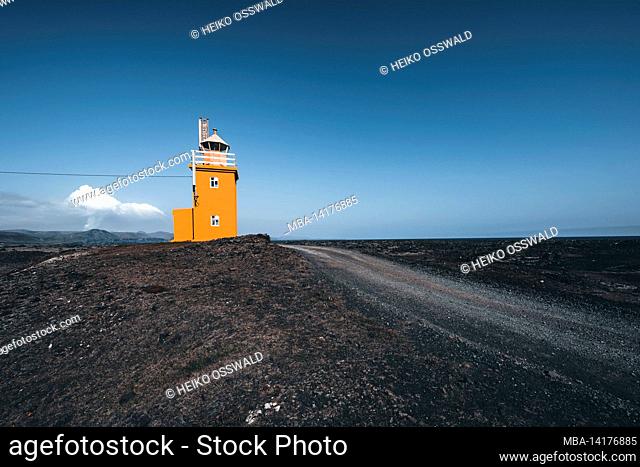 Lighthouse with active volcano in the background, Hópsnesviti, Iceland