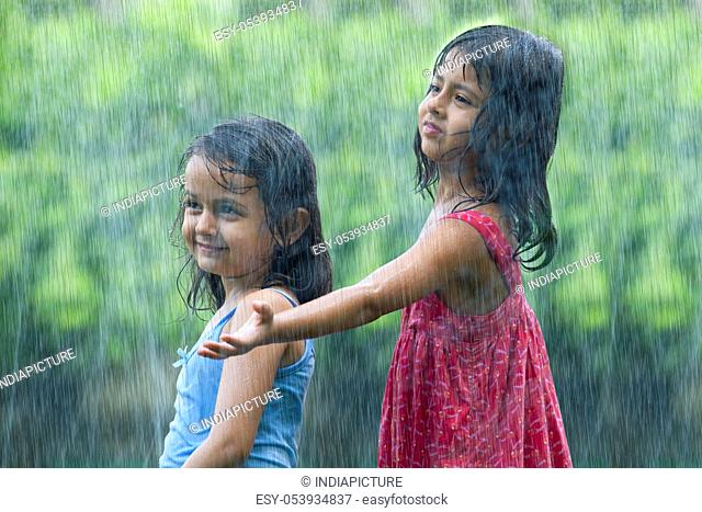 Girls standing in the rain