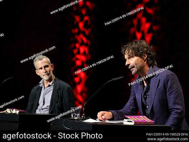 14 September 2023, Hamburg: Moritz Rinke (r), author, and Ulrich Matthes, actor, read at the opening of the 15th Harbour Front Literature Festival in the Small...