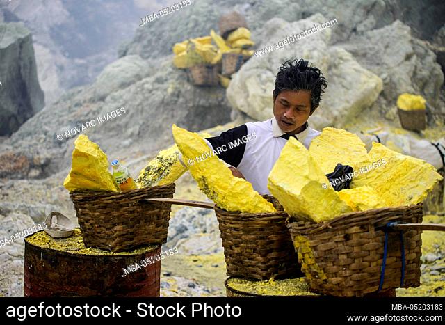 Sulfur mining on the crater lake of the Ijen volcano, Java, Indonesia