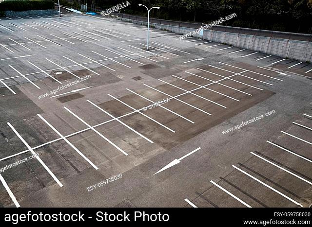 Parking lot with empty places, no cars