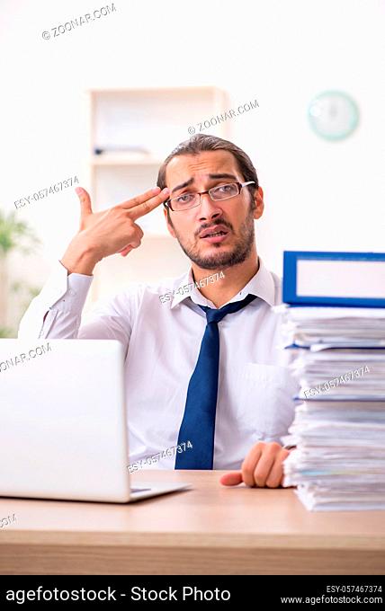 Businessman unhappy with excessive work in the office