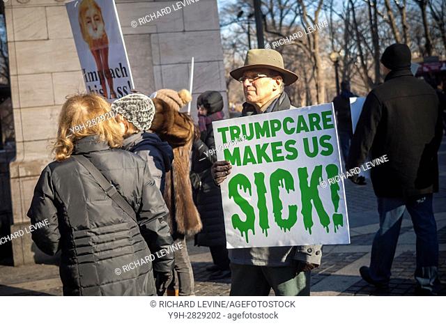 Hundreds of concerned New Yorkers protest in Columbus Circle in New York against president-elect Donald Trump and the discontinuance of the Affordable Care Act...