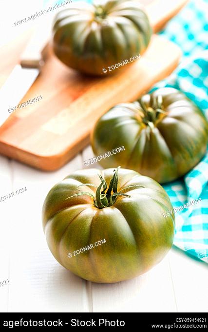 Dark brandywine tomatoes on kitchen table