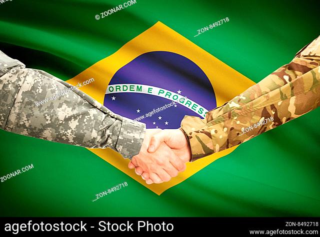 Soldiers shaking hands with flag on background - Brazil