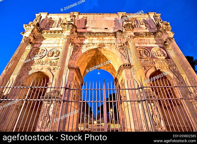 Arch of Constantine square in Rome evening illuminated view, famous landmarks of capital of Italy