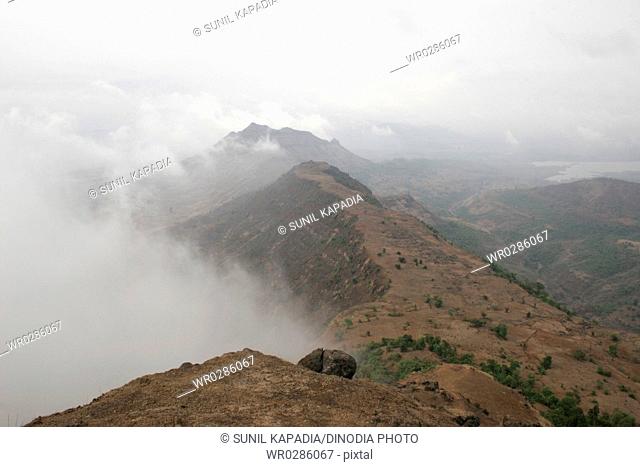 Landscape of western ghat with monsoon clouds rising from valley , Matheran , Maharashtra , India