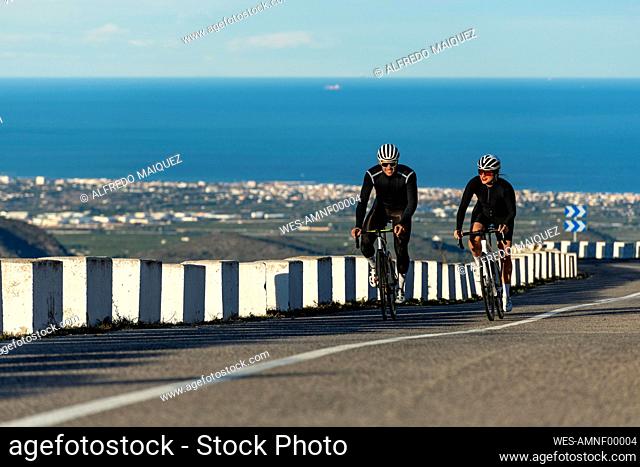 Cyclists competing with each other on Costa Blanca mountain pass in Alicante, Spain