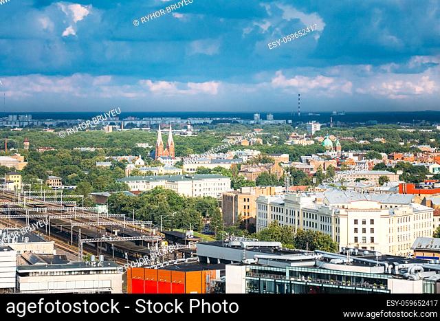 Riga, Latvia. Aerial Cityscape In Sunny Summer Day. Top View Of Landmarks - Riga Central Station, St. Francis Church, Ministry Of Transportation And All Saints...