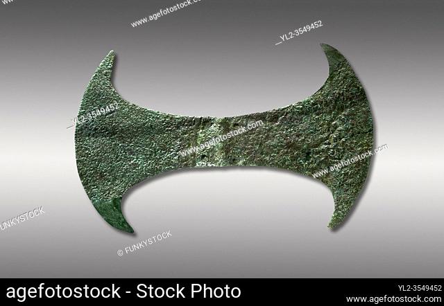 Minoan cult bronze double axe 'labrys', 1600-1400 BC, Heraklion Archaeological Museum, grey background. . . In Minoan Crete