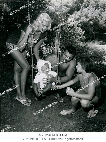 Jan 1, 1960 - On the swing, Baby Mikos gets encouragement from the whole family as he prepares to embark on his first swing
